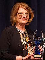 Karin Rieger holds Ovation Award